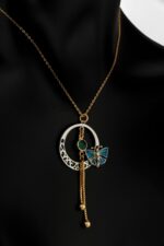Necklace with silver and copper metal with gold plating and synthetic Gibson stone