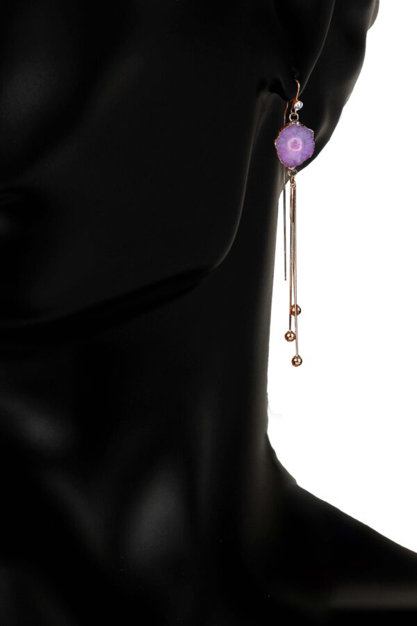A copper metal earring with gold plating and geode agate stone