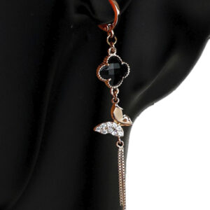An earring made of copper metal with gold plating, the stone of which is synthetic onyx