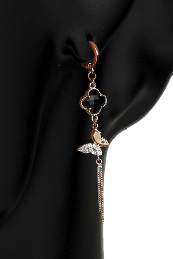 An earring made of copper metal with gold plating, the stone of which is synthetic onyx